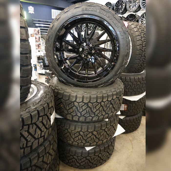 TIS Wheels 547B Gloss Black 24x12 -44mm Offset 6x135,6x139.7 (6x5.5) Nitto Tires Recon Grappler A/T 35x12.50R24 F Wheel And Tire Package